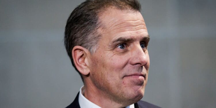 Hunter Biden, son of President Joe Biden, listens as his attorney Abbe Lowell makes a statement to the press following a closed-door deposition before lawmakers in the O'Neill House Office Building in Washington on Feb. 28.