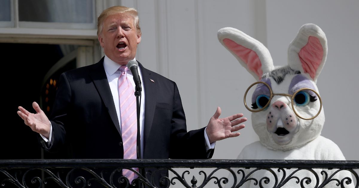 President Donald J. Trump standing next to an individual in an Easter Bunny suit in 2019.