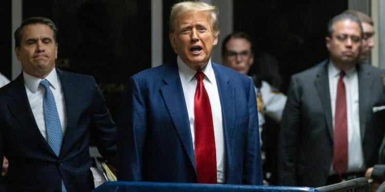 Former President Donald Trump speaks to the media after a pretrial hearing in New York City on Monday.