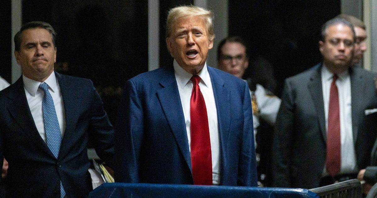 Former President Donald Trump speaks to the media after a pretrial hearing in New York City on Monday.