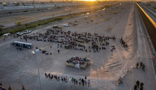 Immigrants Push Past Guards and Rush the Border Fence – HotAir