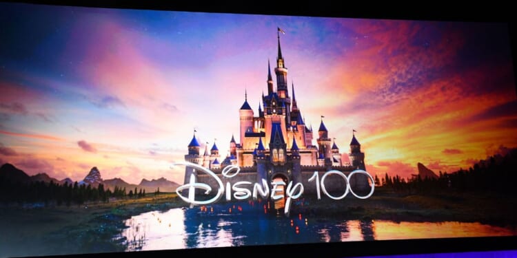 The Disney logo celebrating 100 years is displayed on stage during CinemaCon 2023 Disney studios presentation at Caesars Palace in Las Vegas, Nevada, on April 26, 2023.