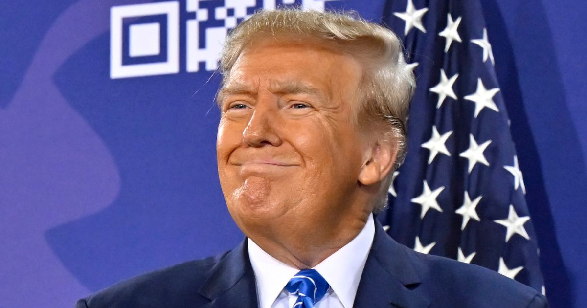 Republican presidential candidate and former President Donald Trump smiles during a campaign event at Big League Dreams in Las Vegas on Jan. 27.