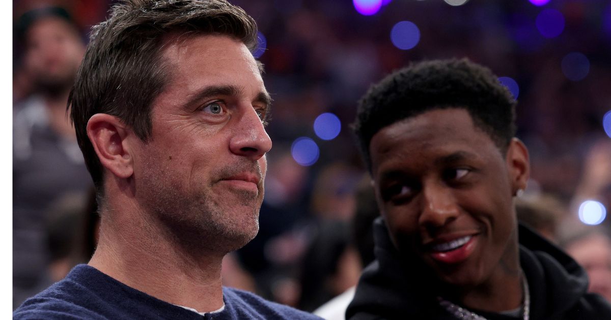 New York Jets players Aaron Rodgers, left, and Sauce Gardner, right, attend game two of the Eastern Conference Semifinals between the New York Knicks and the Miami Heat in New York City on May 2, 2023.