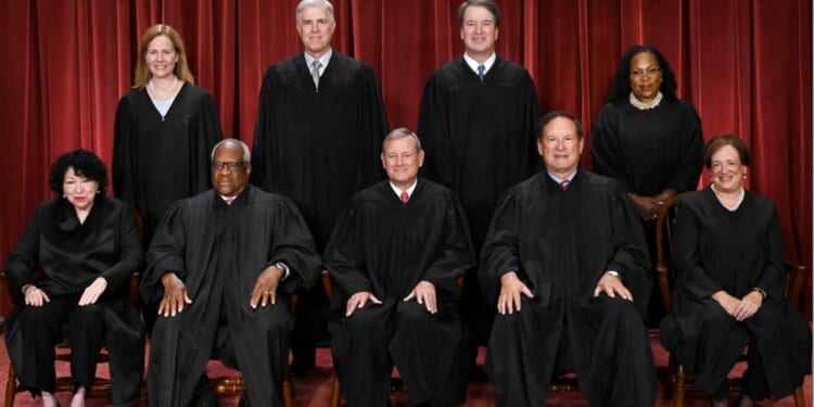 Supreme Court are pictured in their official photo in October 2022. Seated, from left: Associate Justice Sonia Sotomayor, Associate Justice Clarence Thomas, Chief Justice John Roberts, Associate Justice Samuel Alito and Associate Justice Elena Kagan. Standing, from left:  Associate Justice Amy Coney Barrett, Associate Justice Neil Gorsuch, Associate Justice Brett Kavanaugh and Associate Justice Ketanji Brown Jackson.