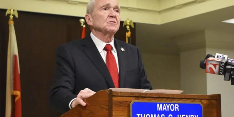 Fort Wayne Mayor Tom Henry speaks with reporters and his staff in the Indiana city on Feb. 26. Henry announced during the day that he had been diagnosed with late-stage stomach cancer. Henry died on Thursday.