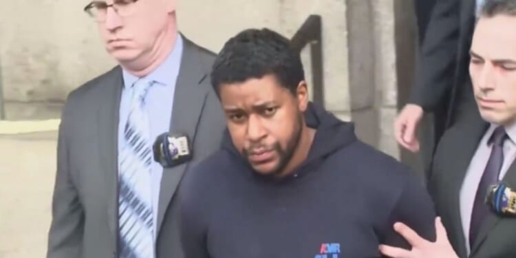 New Yorkers shouted at Lindy Jones, who is accused of fatally shooting New York Police Department Officer Jonathan Diller, as he was escorted by NYPD detectives.