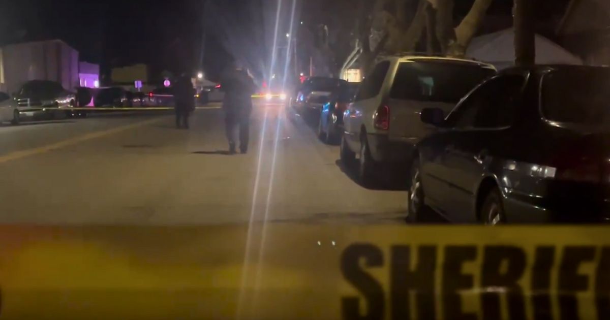 Police work the scene of a shooting at a house party in King City, California, on Sunday.