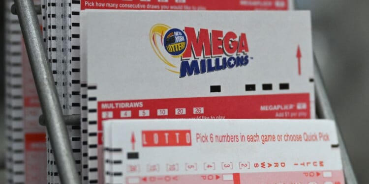 Lottery tickets for the Mega Millions jackpot are pictured at a store in New York on Aug. 8.