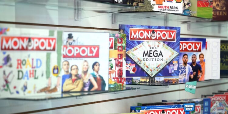 A series of boxed Monopoly board games lined up next to one another at the 2022 Toy Fair in London, England.