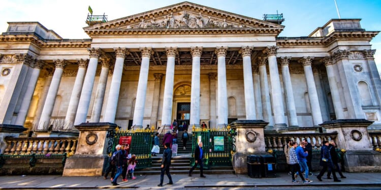 People visit the Fitzwilliam Museum in Cambridge, England, on Feb. 22, 2019.