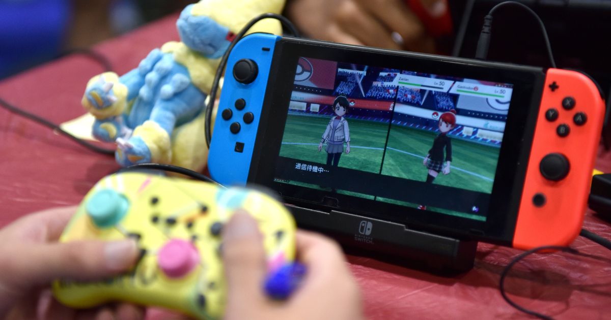 A competitor plays Pokemon on a Nintendo Switch console during the 2022 Pokémon World Championships at ExCel on August 18, 2022 in London, England.