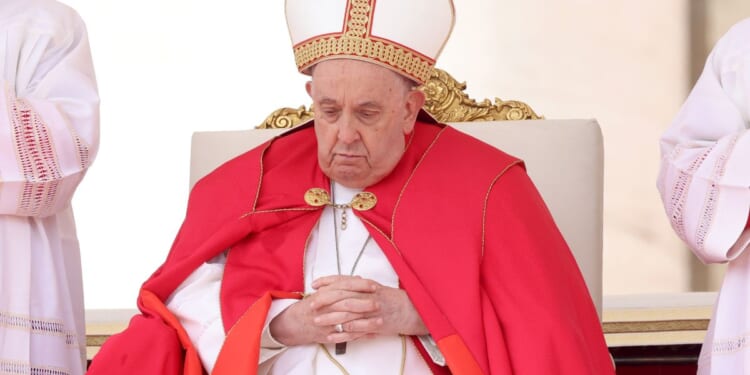 Pope Francis presides over Palm Sunday Mass at St. Peter's Square in Vatican City on Sunday.