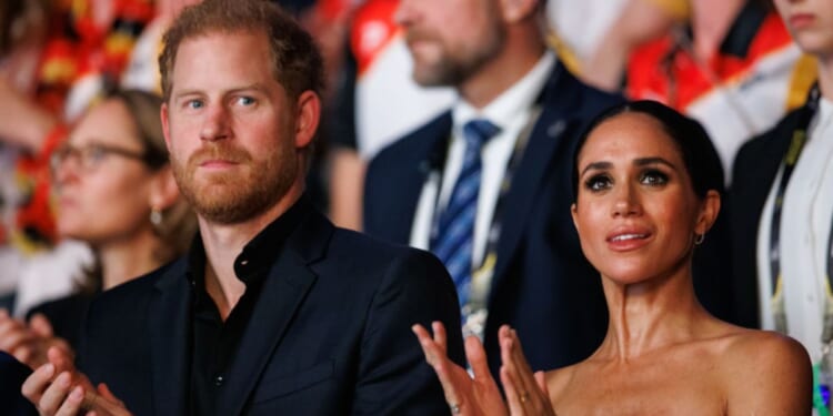 Prince Harry, left, and Meghan, Duchess of Sussex, right, are seen during the closing ceremony of the Invictus Games Düsseldorf 2023 in Düsseldorf, Germany, on Sept. 16.