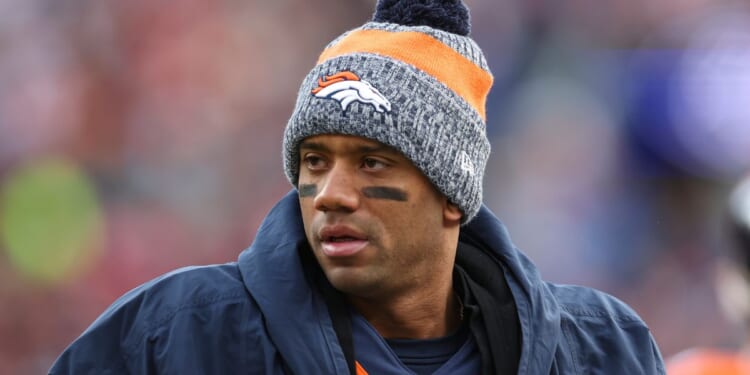 Then-Denver Bronco quarterback Russell Wilson looks on from the sideline during an NFL football game against the Los Angeles Chargers in Denver, Colorado, on Dec. 31.