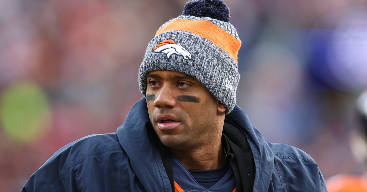 Then-Denver Bronco quarterback Russell Wilson looks on from the sideline during an NFL football game against the Los Angeles Chargers in Denver, Colorado, on Dec. 31.