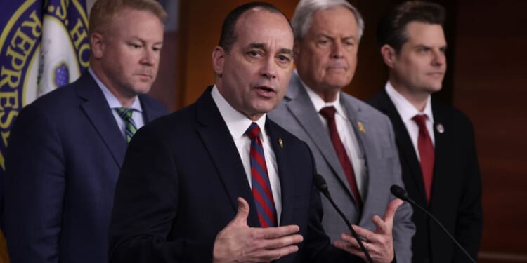 House Freedom Caucus Chairman Rep. Bob Good speaks as, from left, Rep. Warren Davidson, Ralph Norman and Matt Gaetz listen during a news conference at the U.S. Capitol in Washington on Feb. 13.