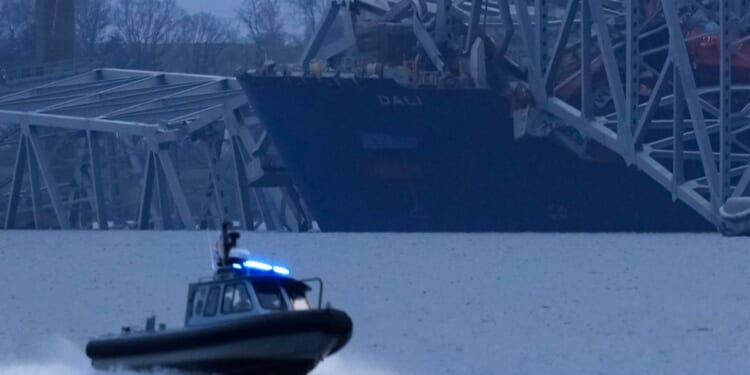 The cargo ship Dali is covered in the wreckage of the collapsed Francis Scott Key Bridge in Baltimore, Maryland, on Tuesday.