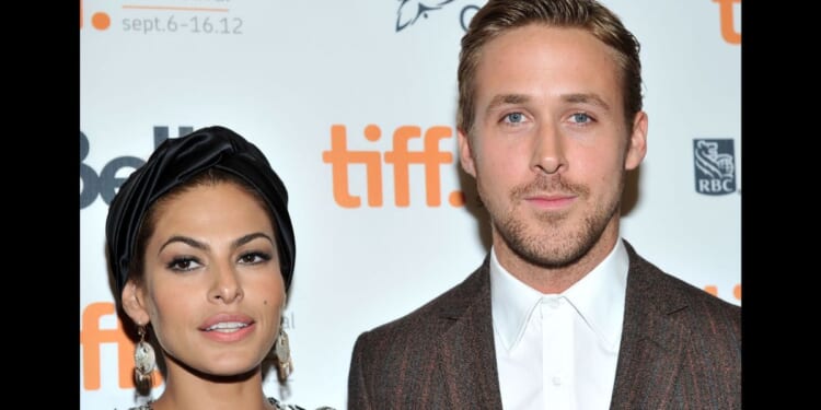 Eva Mendes, left, and Ryan Gosling, right, attend "The Place Beyond The Pines" premiere during the 2012 Toronto International Film Festival in Toronto, Canada, on Sept. 7, 2012.