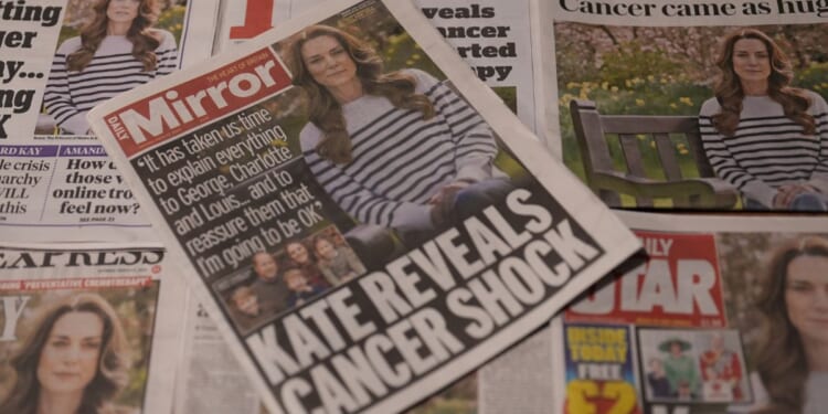 U.K. newspaper front pages, including The Daily Telegraph, Daily Express, The Star, The Daily Mail, The Guardian and The Times, display an image of Britain's Catherine, Princess of Wales from an announcement video on her cancer diagnosis in London, England, on Saturday.