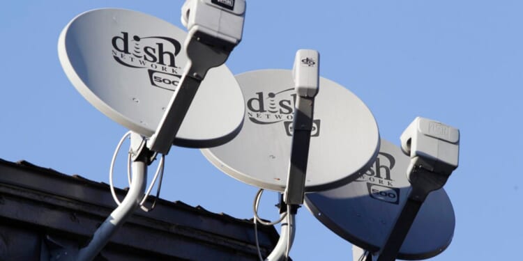 Dish Network satellite dishes are shown at an apartment complex in Palo Alto, California.