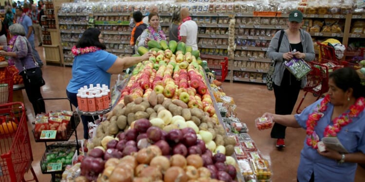 Shoppers peruse the produce section at Trader Joe's in a Pinecrest, Florida in a file photo from October 2013.