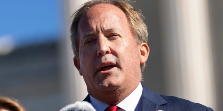 Texas Attorney General Ken Paxton speaks outside the U.S. Supreme Court in Washington, D.C., on Nov. 1, 2021.