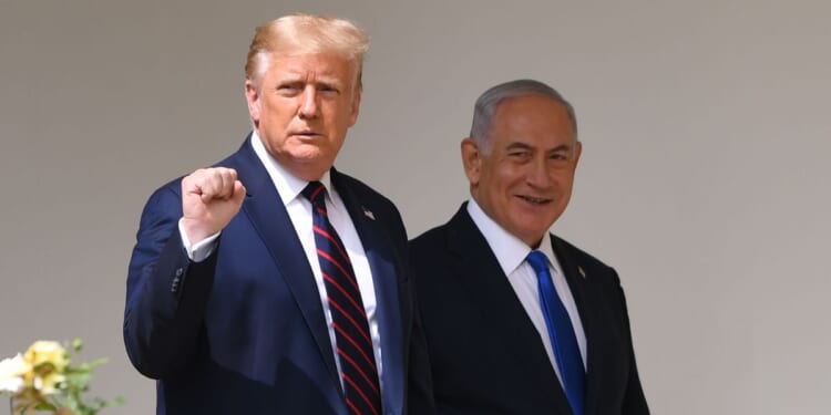 Then-President Donald Trump, left, and Israeli Prime Minister Benjamin Netanyahu, right, arrive to participate in the signing of the Abraham Accords at the White House in Washington, D.C., on Sept. 15, 2020.