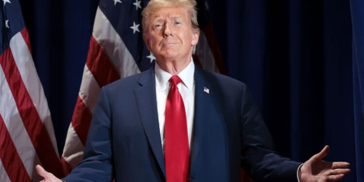 Republican presidential candidate and former President Donald Trump reacts to supporters as he arrives on stage during a Get Out the Vote Rally, Saturday, in Richmond, Virginia.