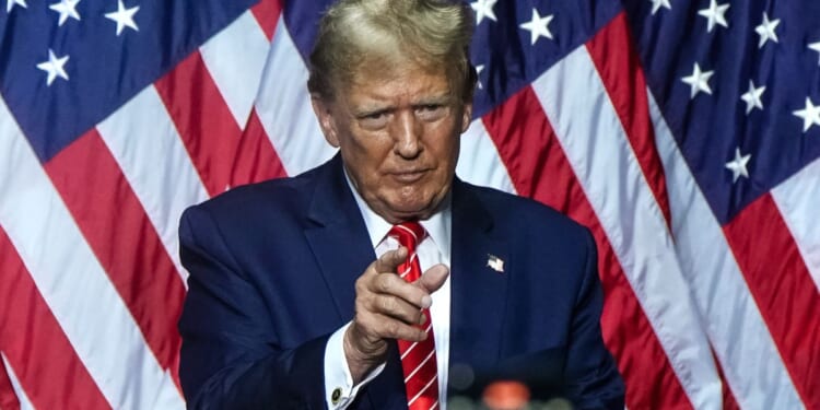 Former President Donald Trump gestures to the crowd after speaking at a campaign event in Rome, Georgia, on March 9.