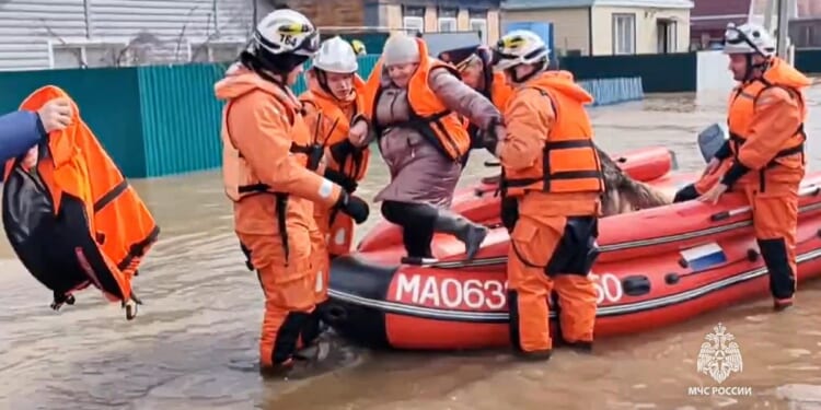 Thousands are evacuated after floods break a dam in the Russian city of Orsk