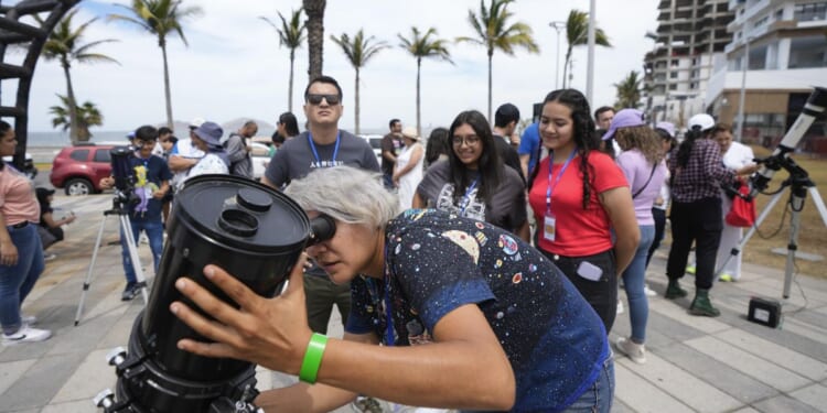 Millions of people await a total solar eclipse in North America. Clouds may spoil the view