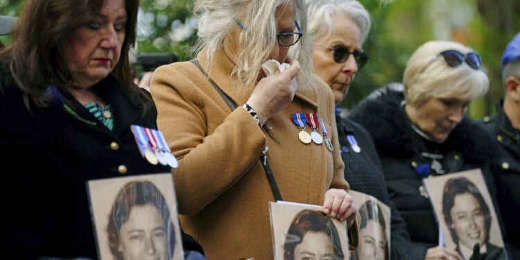 Hundreds pay tribute to police officer fatally shot 40 years ago from inside Libya's U.K. embassy