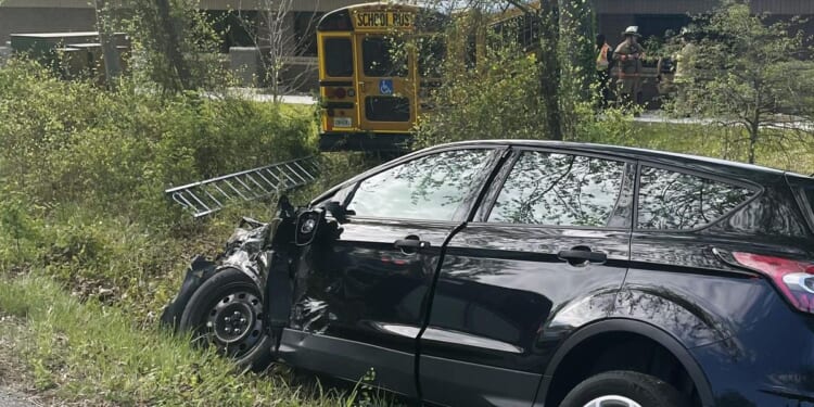 Fairfax County, Virginia, school bus hits DMV building, injures driver, two students, officials say