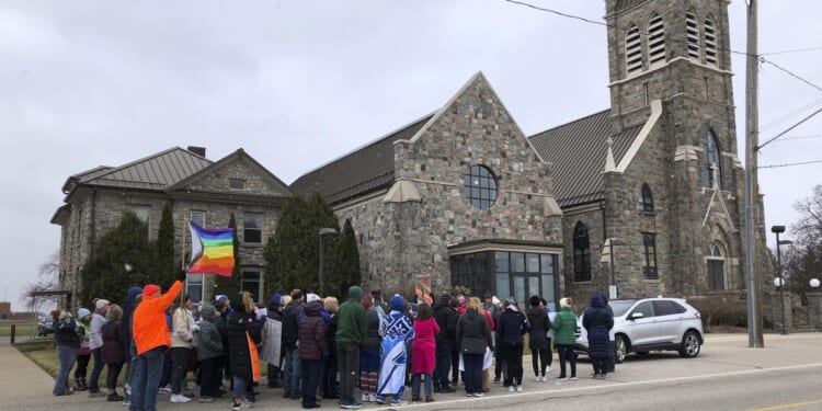 Catholic priest resigns as pastor of Michigan church after protests over his criticism of gay author