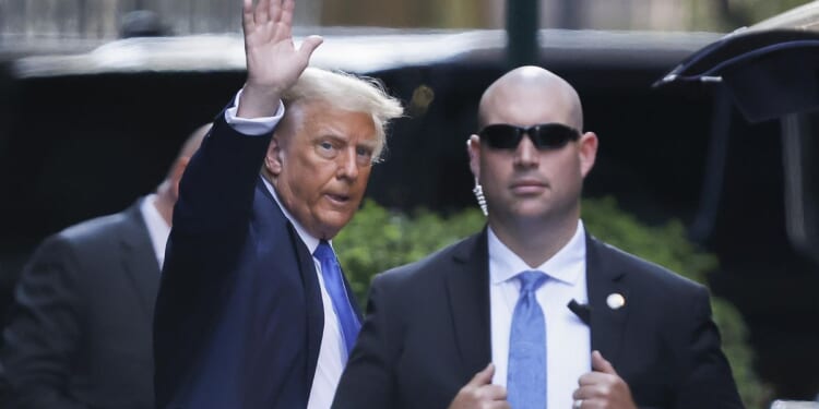 Donald Trump arrives for the start of his criminal trial, an American first