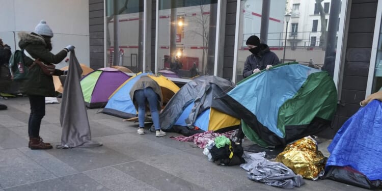 Migrant camp in central Paris cleared out by police. Activists say it's a pre-Olympics sweep