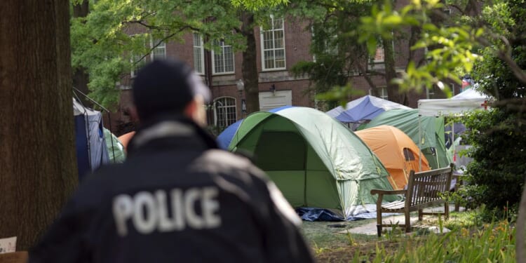 Anti-war student protesters dig in as faculty condemn universities' leadership over calling police