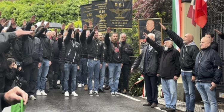 On the anniversary of Benito Mussolini's execution, dozens in Italy give a fascist salute