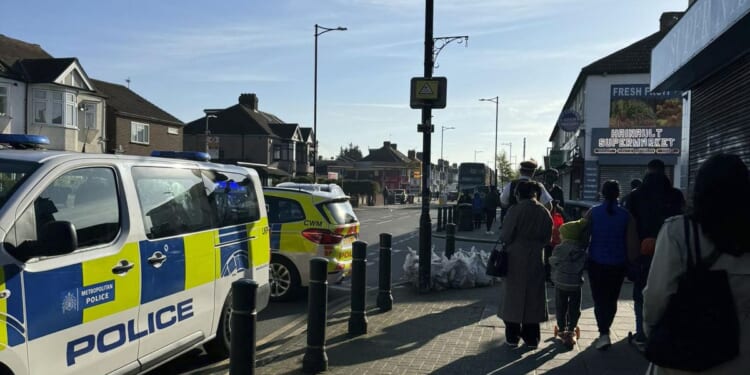 U.K. police arrest man wielding a sword in east London. 5 people are taken to the hospital