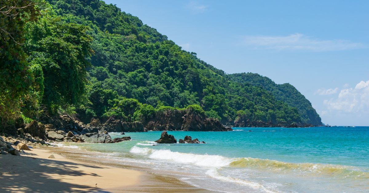 A stock photo shows a bay filled with Caribbean blue water on the island of Tobago.