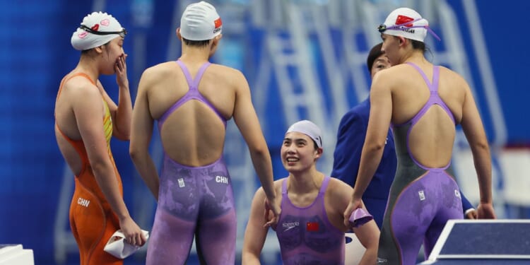 Chinese swimmers -- gold medalist Zhang Yufei, Li bingjie, Wu Qingfeng and Yang Junxuan -- prepare to compete in the Women's 4X100m Freestyle Relay Finals during the Hangzhou 2022 Asian Games in Hangzhou, China, on Sept. 24, 2023.