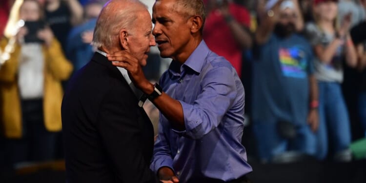 President Joe Biden and former President Barack Obama embrace on stage during a rally for Pennsylvania Democrats on Nov. 5, 2022, in Philadelphia.