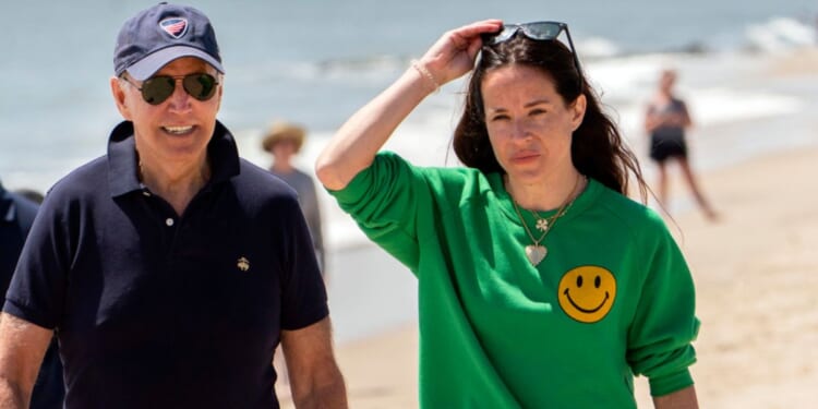 President Joe Biden walks on the beach with daughter Ashley Biden, in Rehoboth Beach, Delaware, June 20, 2022.