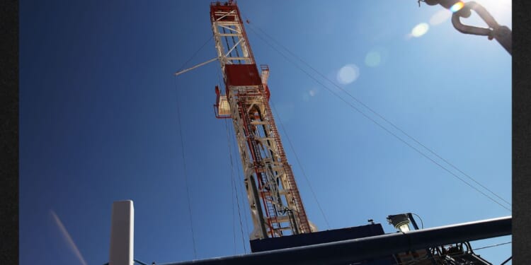 An oil drilling rig drills in Texas in this file photo from 2015.