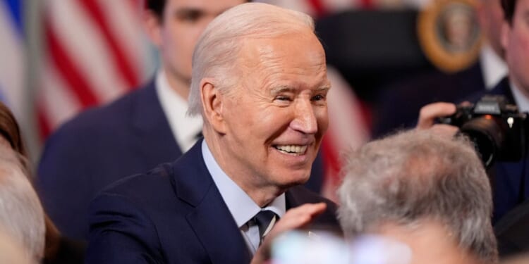 Joe Biden attending a reception in the East Room of the White House