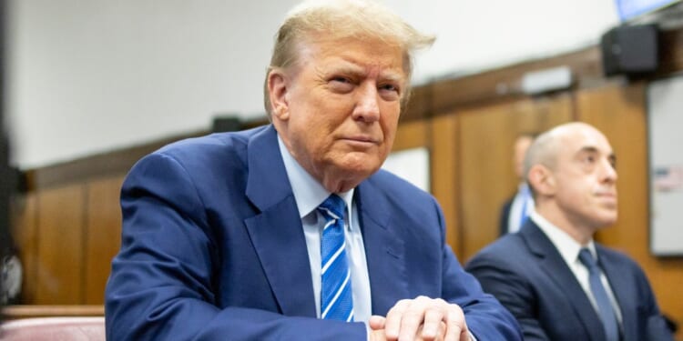 Former President Donald Trump sits in the courtroom during the second day of his criminal trial at Manhattan Criminal Court in New York City on Tuesday.