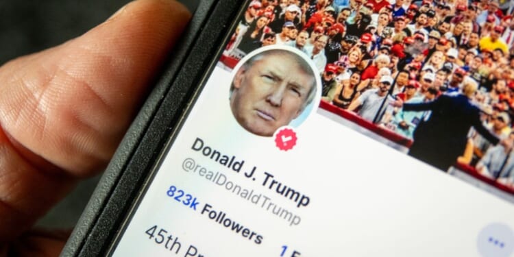 Donald Trump's Truth Social account is pulled up on a smartphone in Bath, England, on April 20.