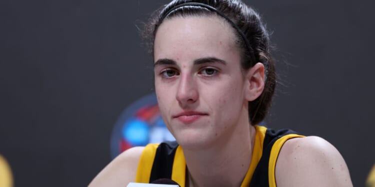 Caitlin Clark of the Iowa Hawkeyes speaks with the media after losing to the South Carolina Gamecocks in the 2024 NCAA Women's Basketball Tournament National Championship in Cleveland, Ohio, on Sunday.