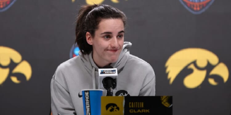 Caitlin Clark of the Iowa Hawkeyes speaks to media Saturday ahead of the 2024 NCAA Women's Final Four National Championship against the South Carolina Gamecocks at Rocket Mortgage Fieldhouse in Cleveland.